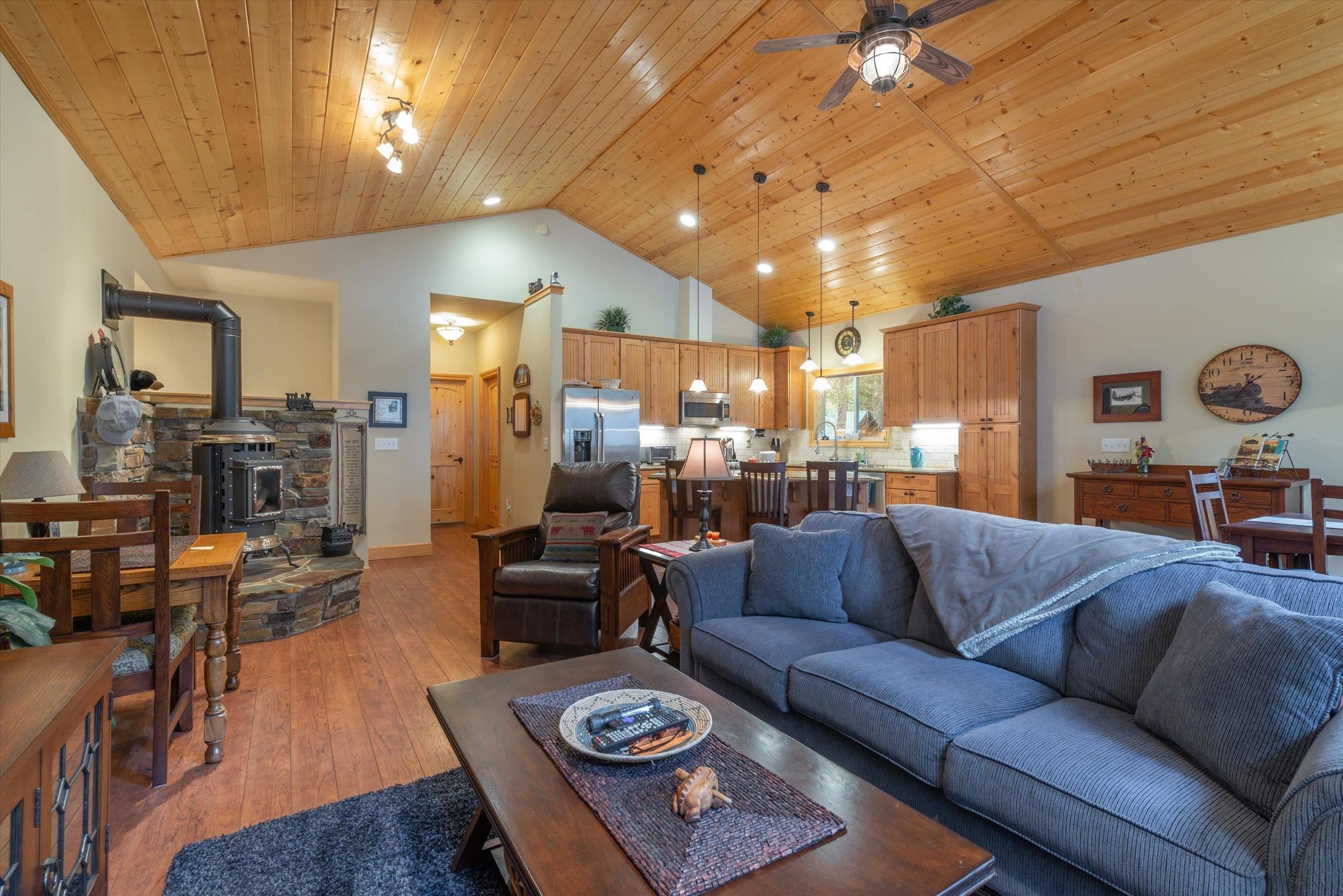 10308 Washoe Road Truckee, CA 96161 - Photo 4 of 21 a living room with furniture kitchen view and a chandelier