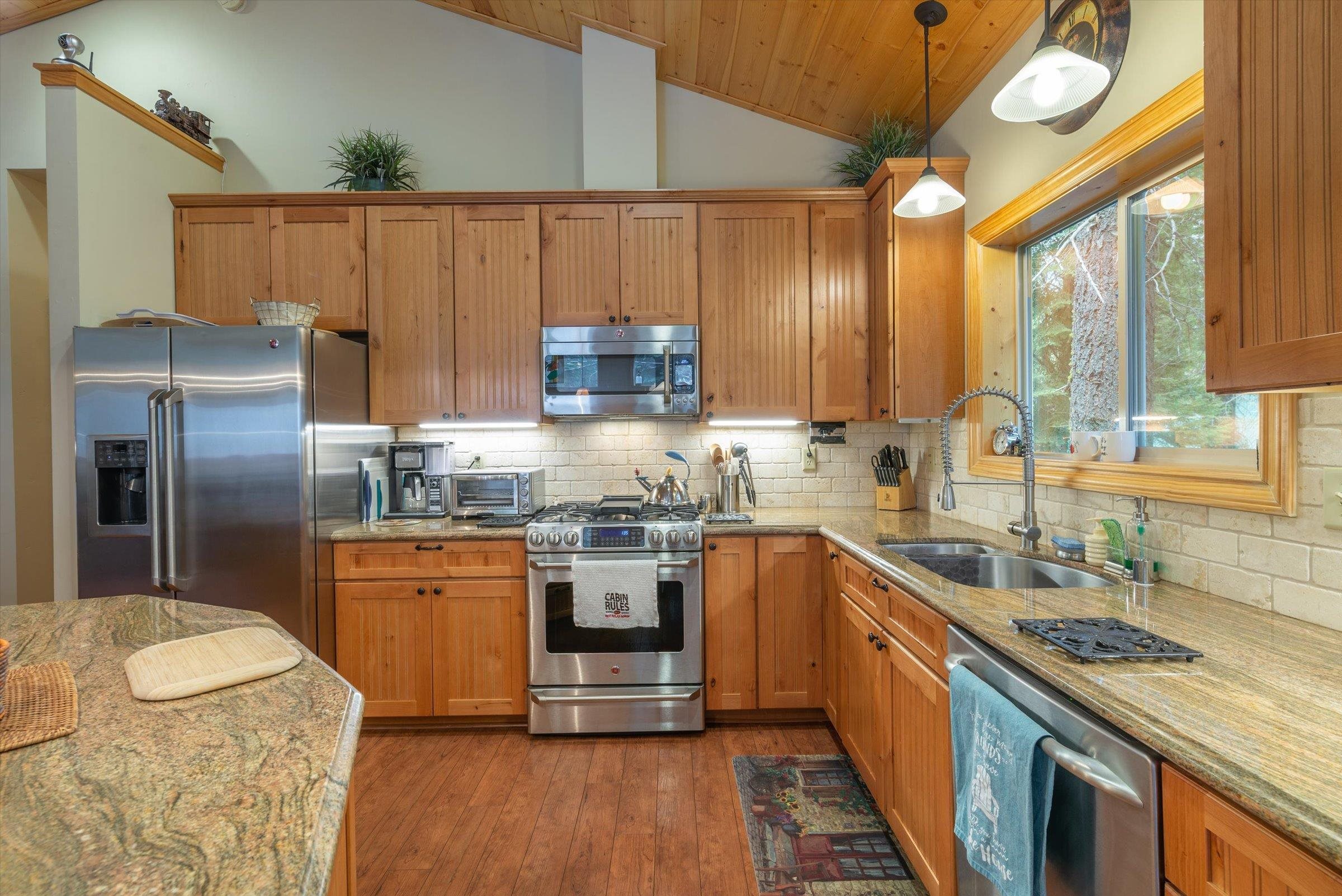 10308 Washoe Road Truckee, CA 96161 - Photo 5 of 21 a kitchen with stainless steel appliances granite countertop a sink a stove and a refrigerator