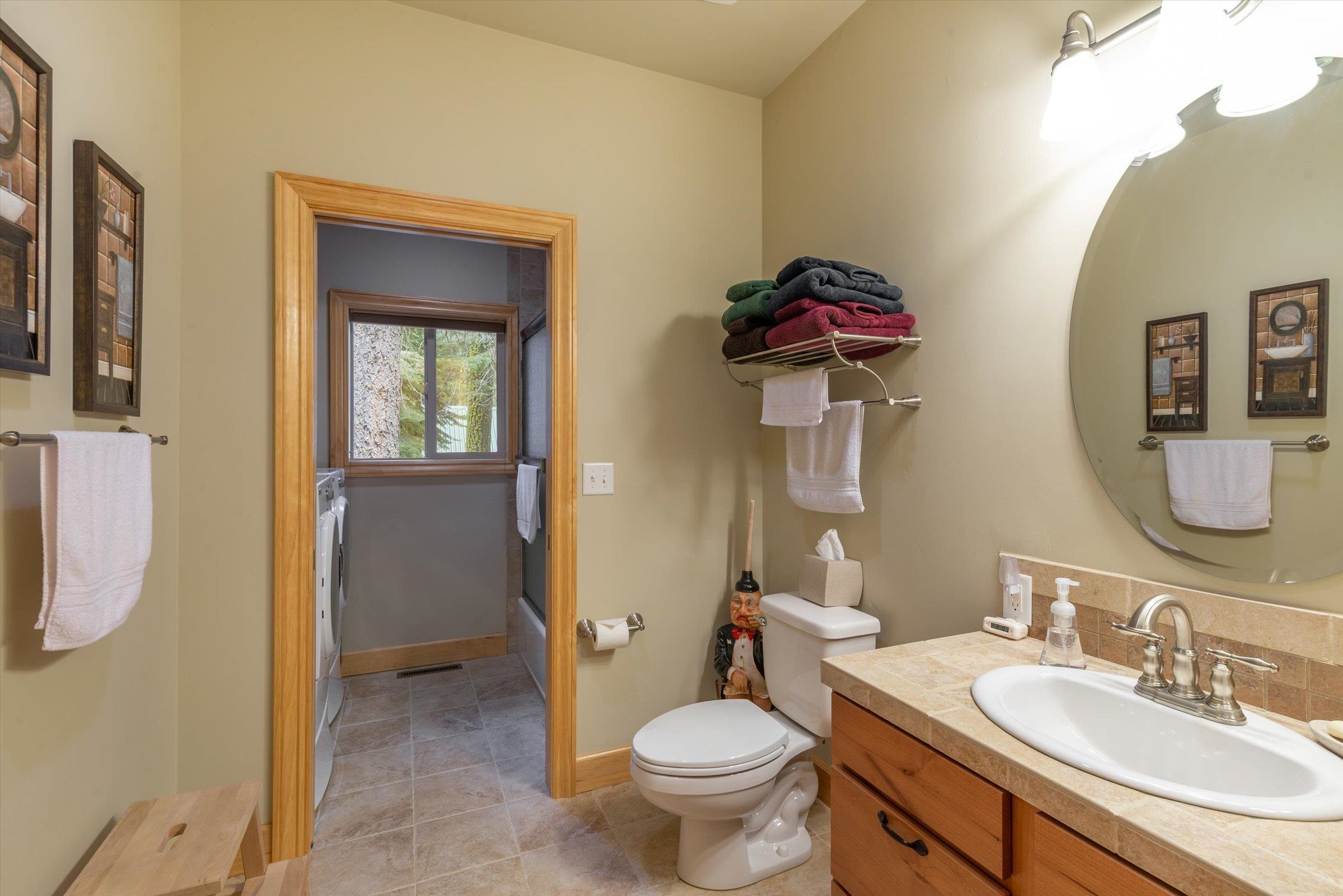 10308 Washoe Road Truckee, CA 96161 - Photo 10 of 21 a bathroom with a toilet sink and mirror