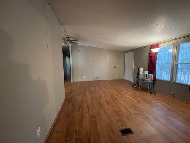 2830 Sha-Al Road Roanoke, VA 24014 - Photo 3 of 17 wooden floor in an empty room with a window