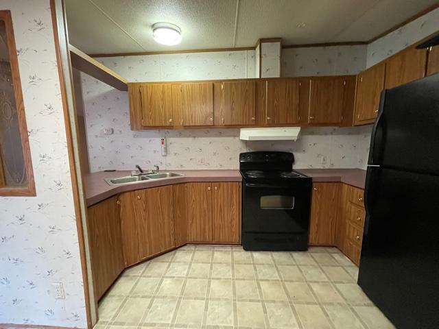 2830 Sha-Al Road Roanoke, VA 24014 - Photo 7 of 17 a kitchen with a sink a stove top oven and refrigerator