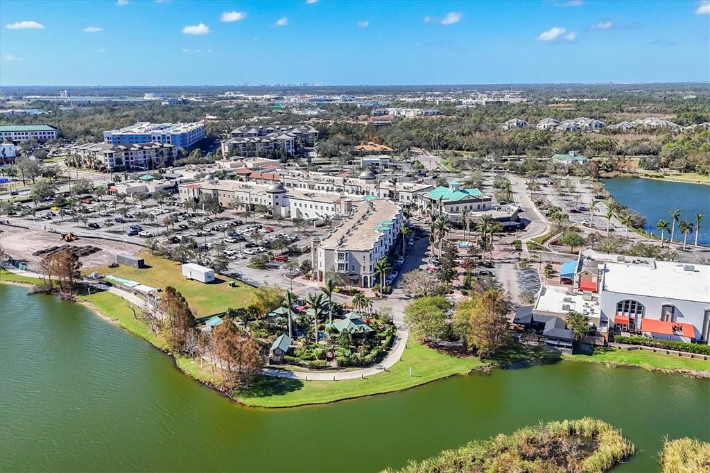 10530 Boardwalk Loop, Unit 601 Bradenton, FL 34202 - Photo 54 of 60 an aerial view of a city with a lake view