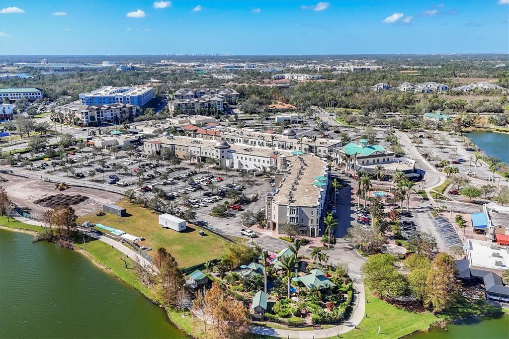 10530 Boardwalk Loop, Unit 601 Bradenton, FL 34202 - Photo 55 of 60 an aerial view of residential houses with outdoor space and lake view in back