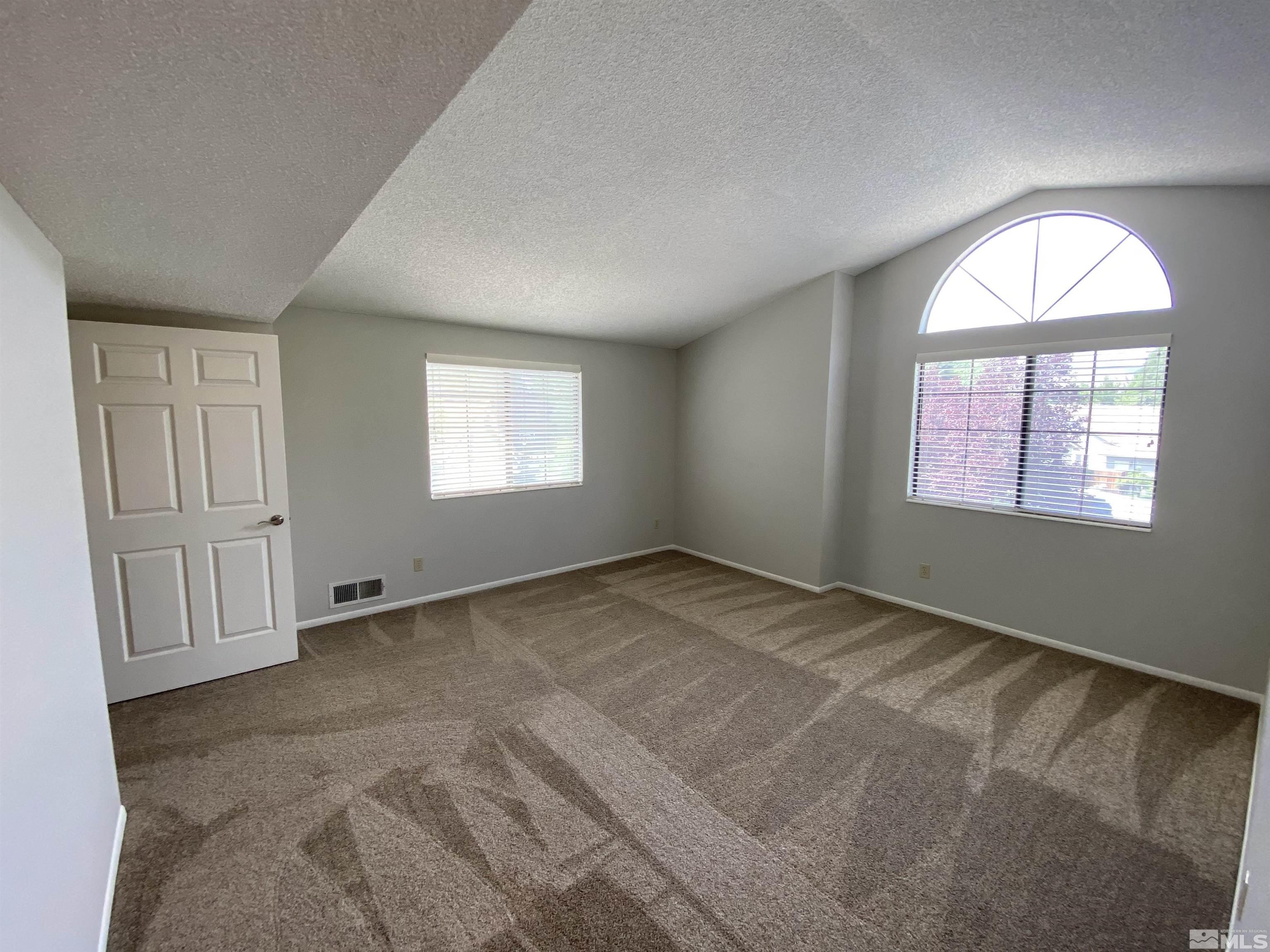 1562 Bramble Court Reno, NV 89509 - Photo 12 of 22 an empty room with windows