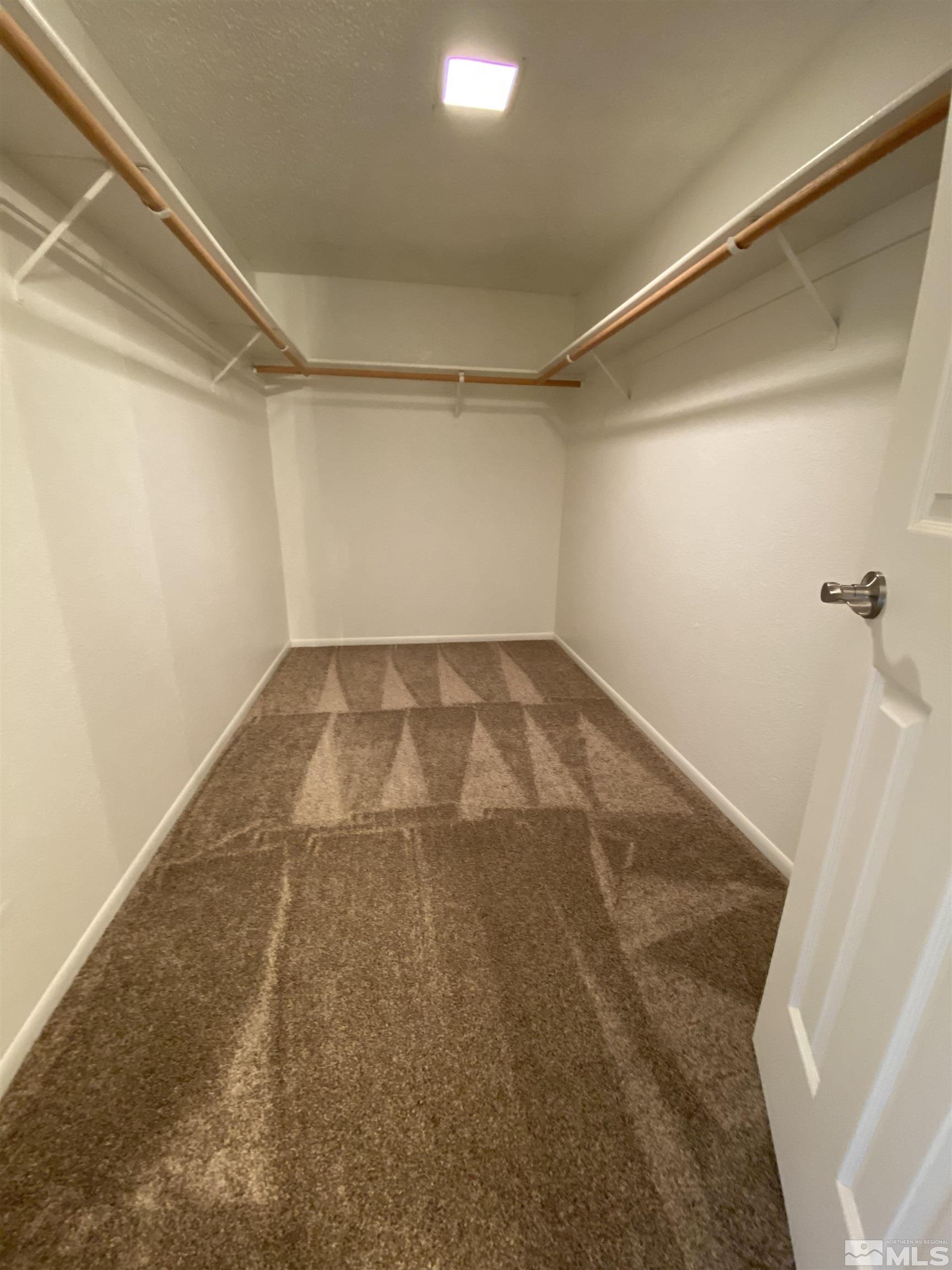 1562 Bramble Court Reno, NV 89509 - Photo 14 of 22 a view of a big room with an empty space