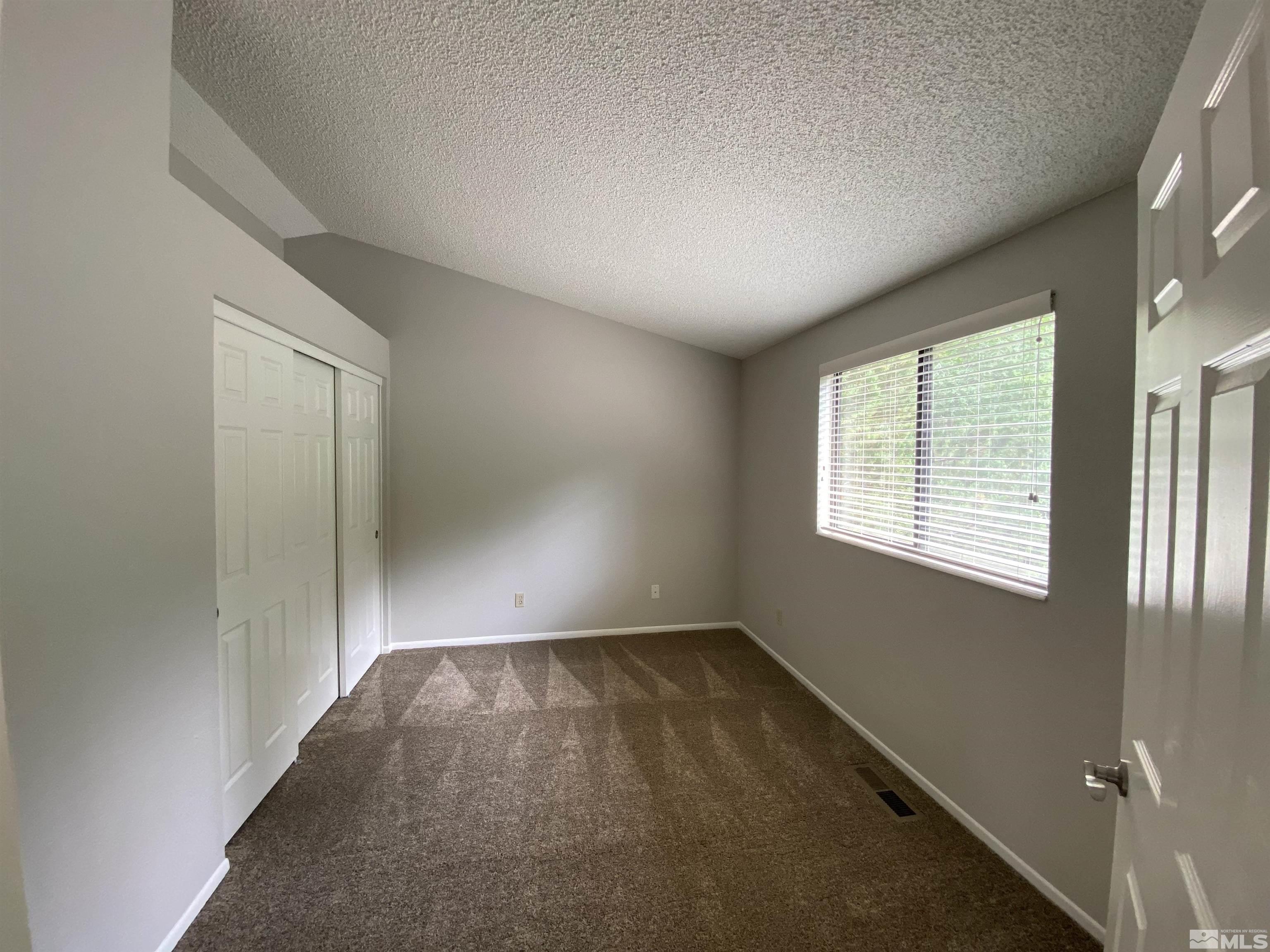 1562 Bramble Court Reno, NV 89509 - Photo 16 of 22 an empty room with windows