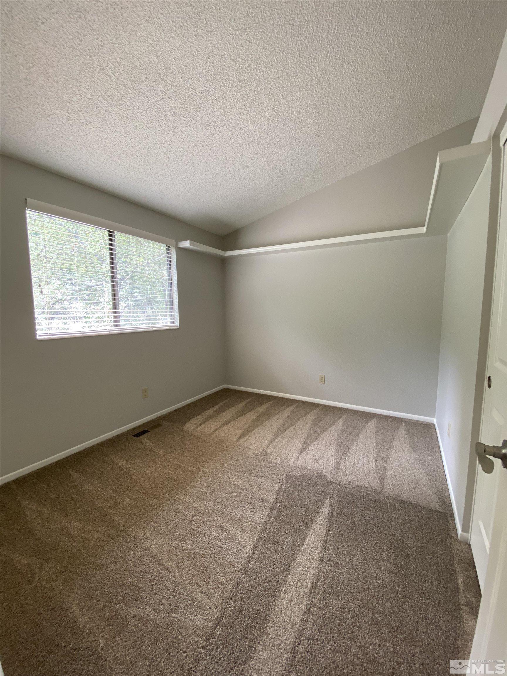 1562 Bramble Court Reno, NV 89509 - Photo 17 of 22 an empty room with windows