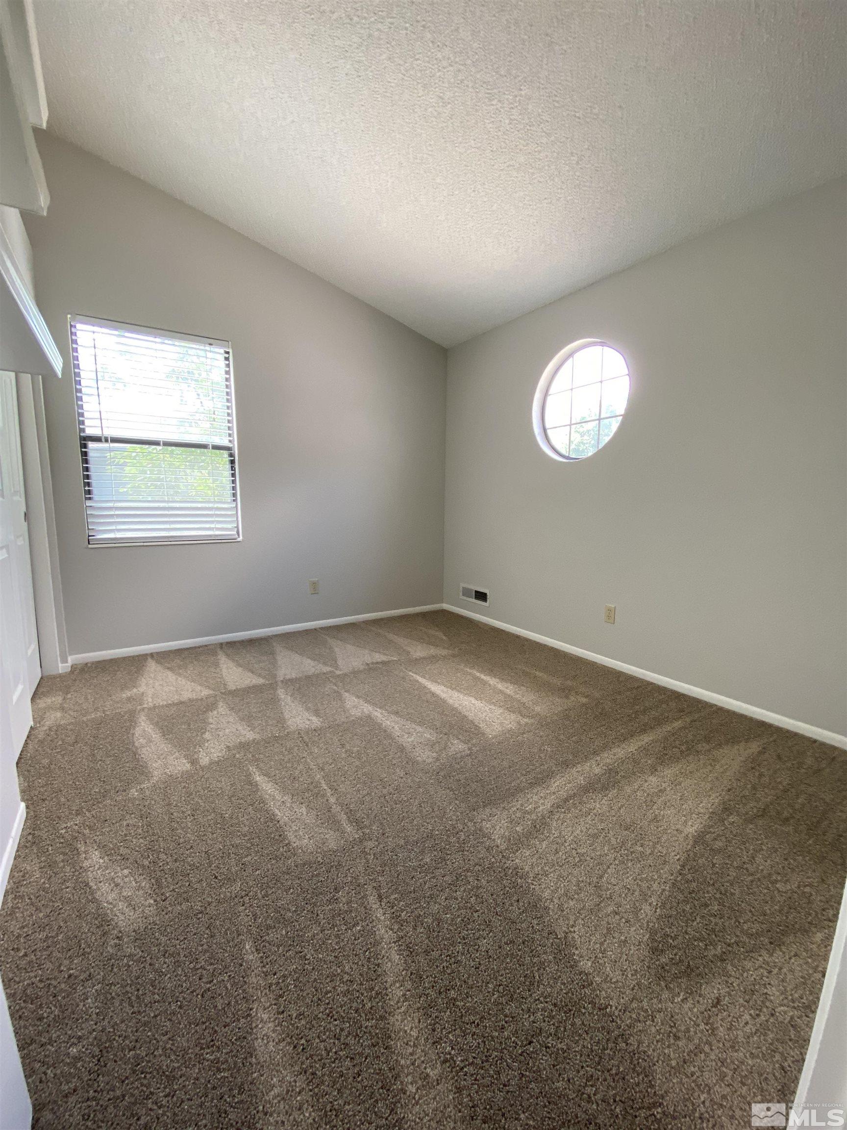1562 Bramble Court Reno, NV 89509 - Photo 18 of 22 an empty room with a window
