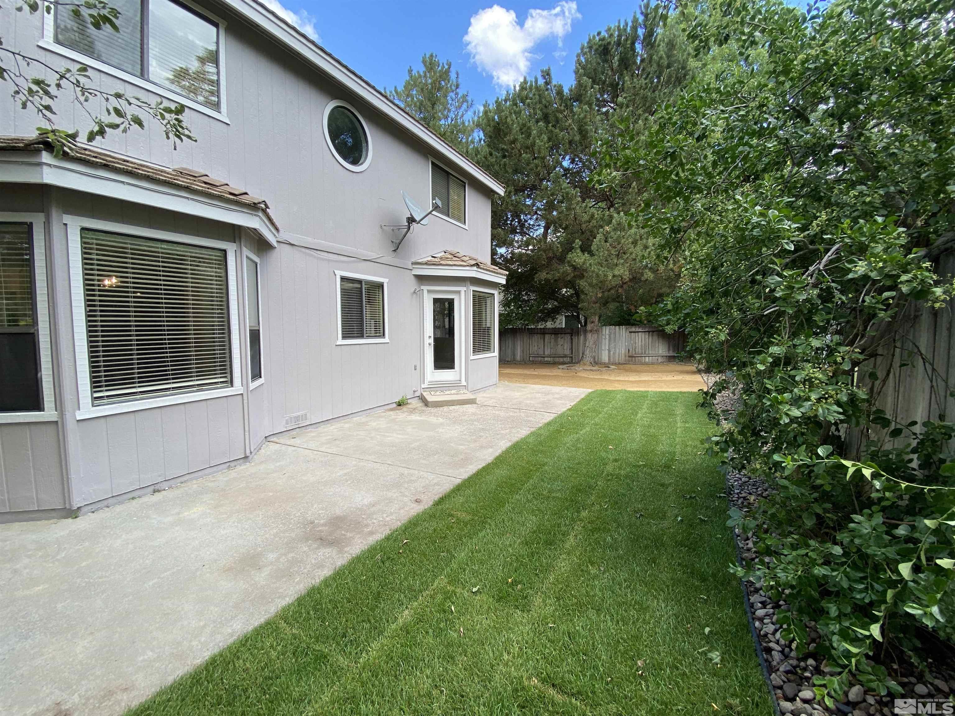 1562 Bramble Court Reno, NV 89509 - Photo 20 of 22 a front view of a house with a yard and porch