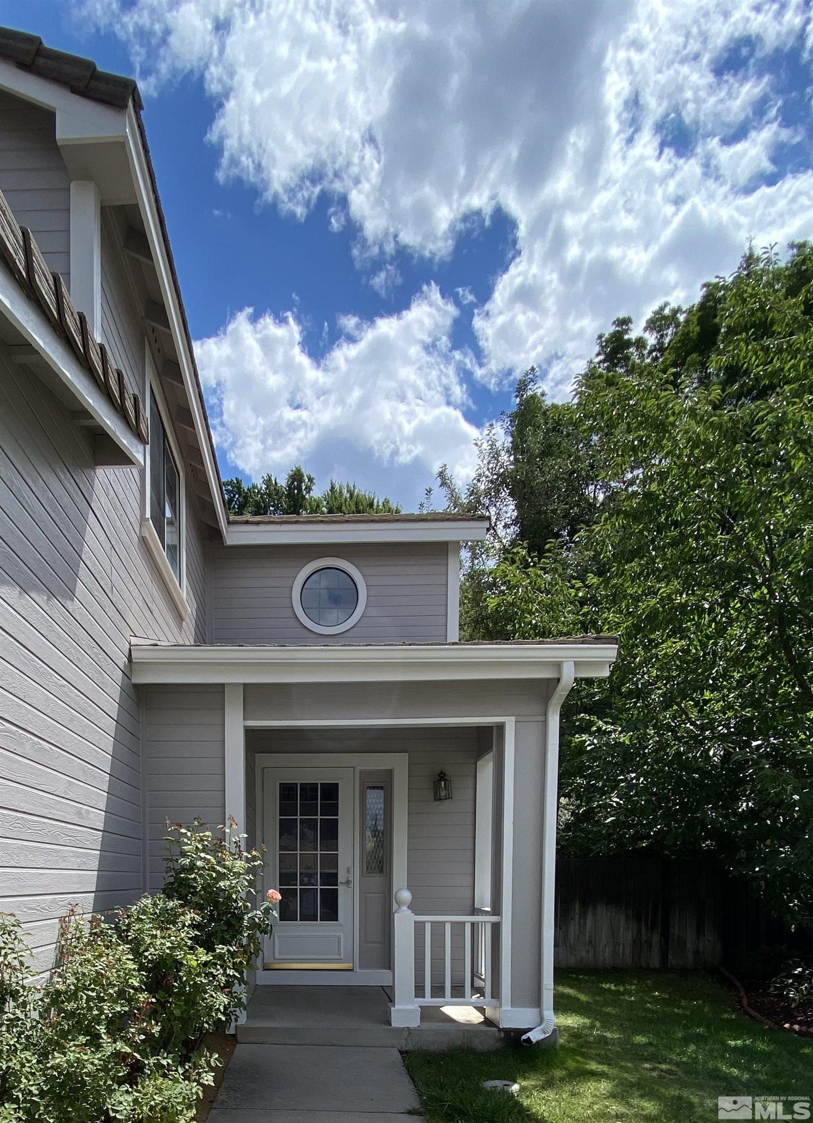 1562 Bramble Court Reno, NV 89509 - Photo 2 of 22 a front view of a house with garden