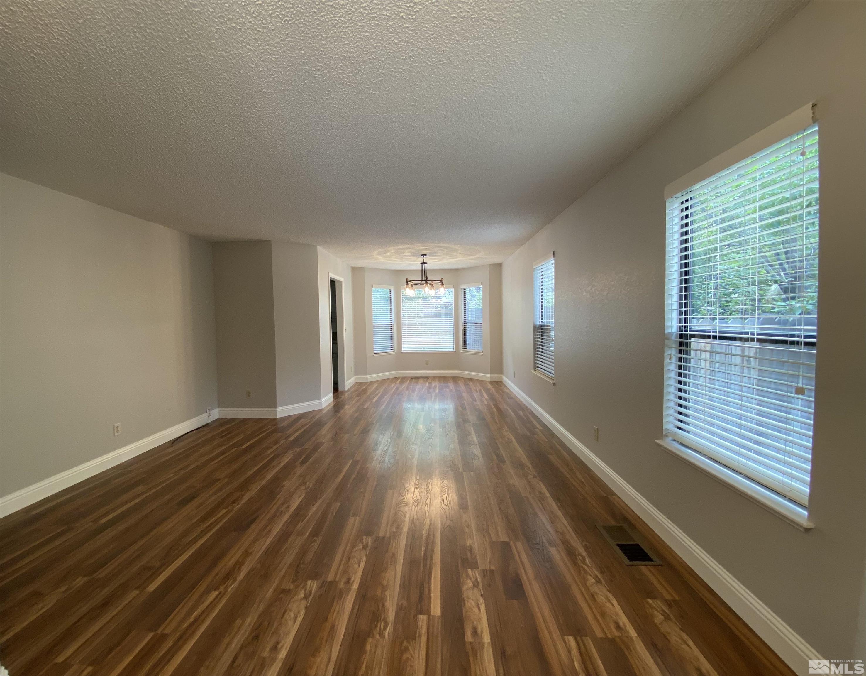 1562 Bramble Court Reno, NV 89509 - Photo 3 of 22 a view of wooden floor in an empty room
