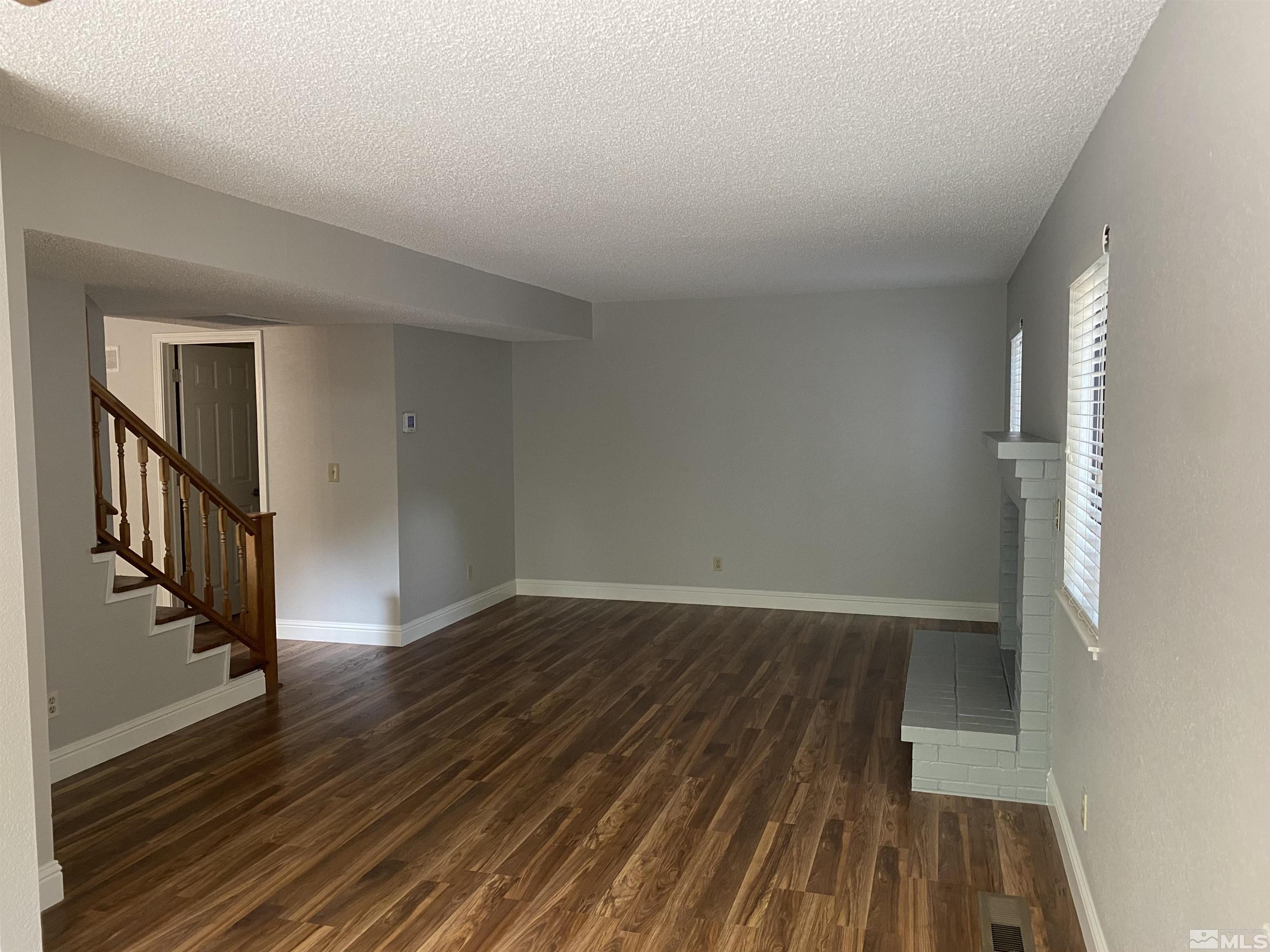 1562 Bramble Court Reno, NV 89509 - Photo 7 of 22 wooden floor in a hall with an entryway