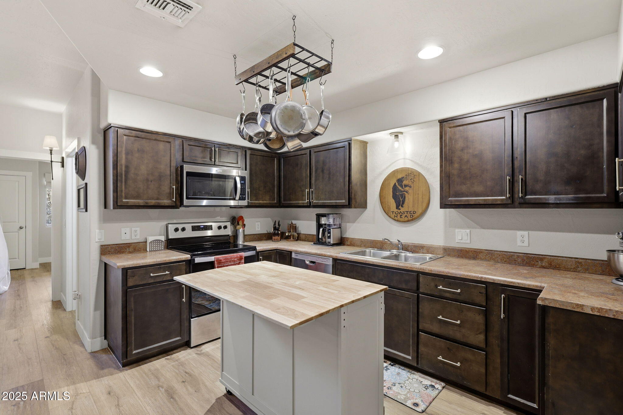 6168 West Starlight Ridge Parkway Lakeside, AZ 85929 - Photo 11 of 39 a kitchen with stainless steel appliances granite countertop a sink and a stove