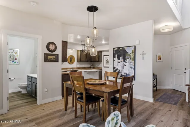 a kitchen with stainless steel appliances granite countertop a sink and a stove
