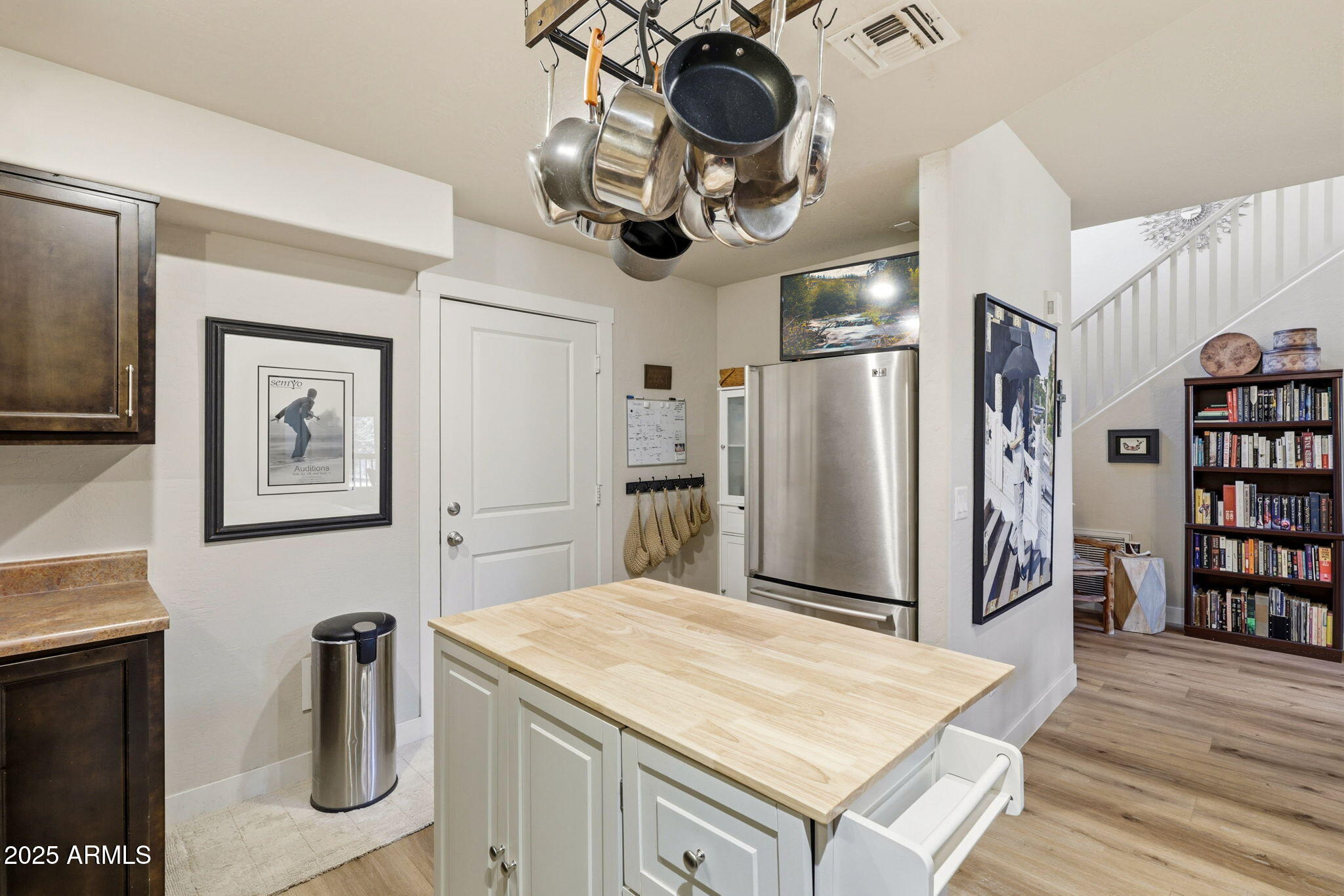 6168 West Starlight Ridge Parkway Lakeside, AZ 85929 - Photo 12 of 39 a kitchen with stainless steel appliances granite countertop a refrigerator a stove and a wooden floors