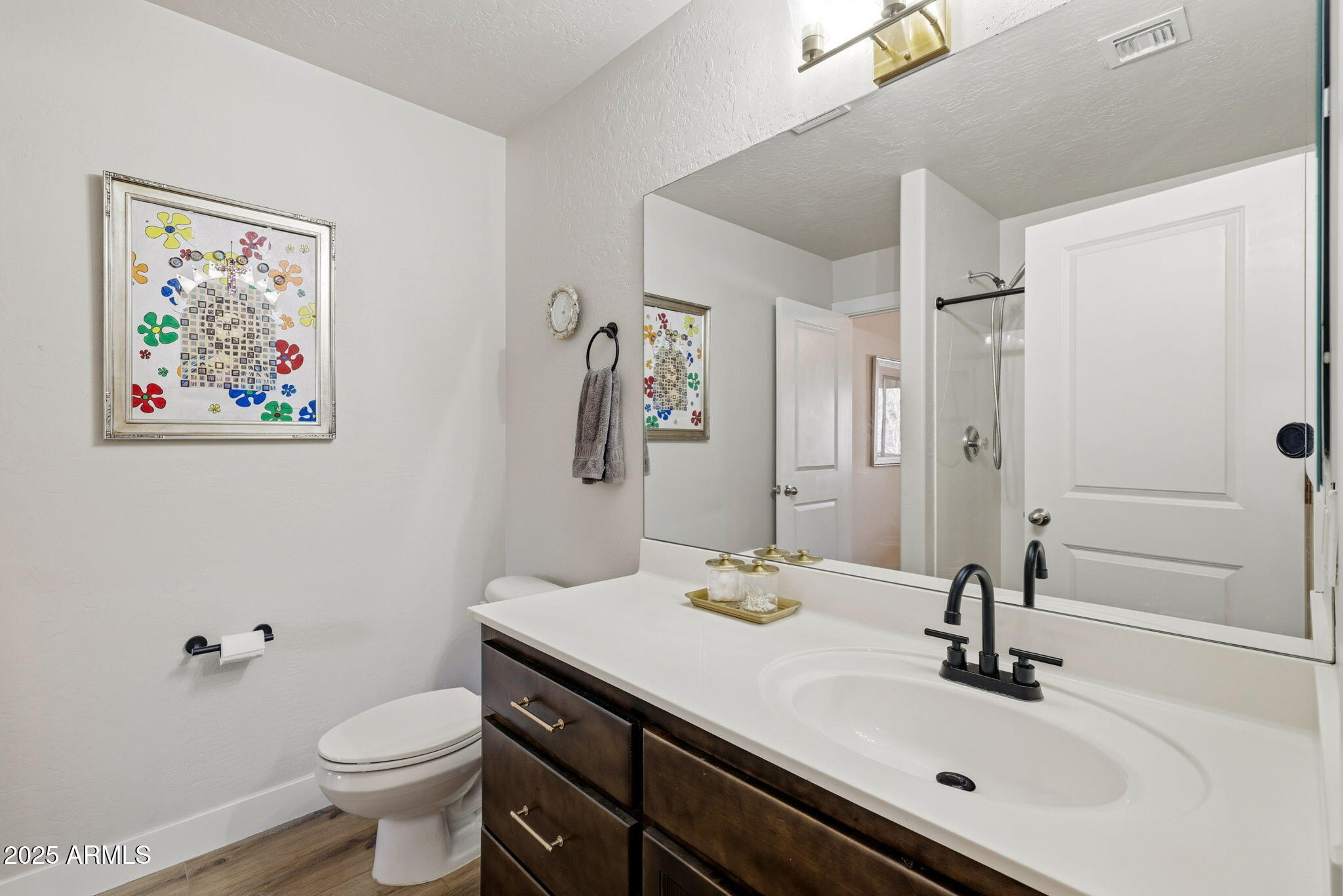 6168 West Starlight Ridge Parkway Lakeside, AZ 85929 - Photo 15 of 39 a bathroom with a sink and a mirror