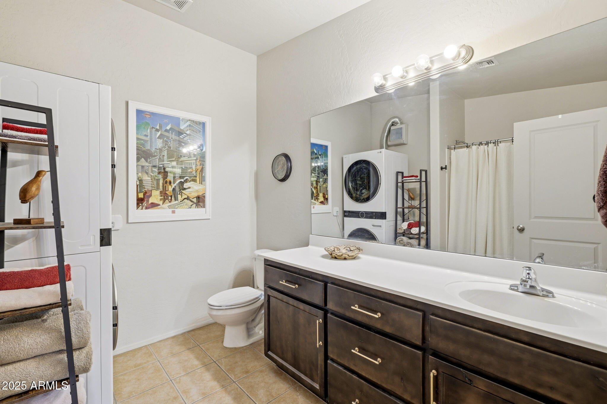 6168 West Starlight Ridge Parkway Lakeside, AZ 85929 - Photo 22 of 39 a bathroom with a toilet a double vanity sink and a mirror