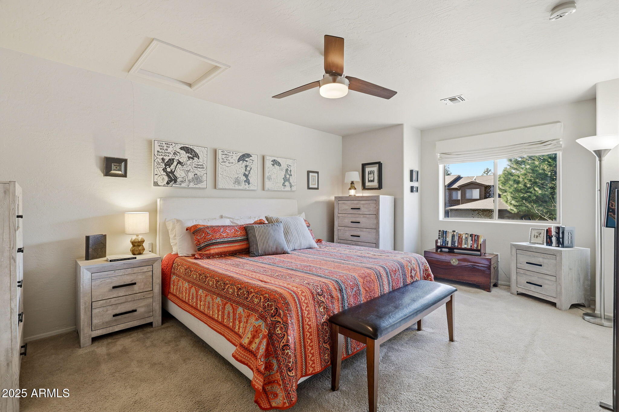 6168 West Starlight Ridge Parkway Lakeside, AZ 85929 - Photo 20 of 42 a bedroom with a bed and a chandelier