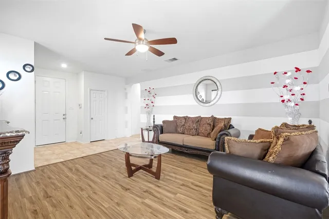 a living room with furniture and a large window