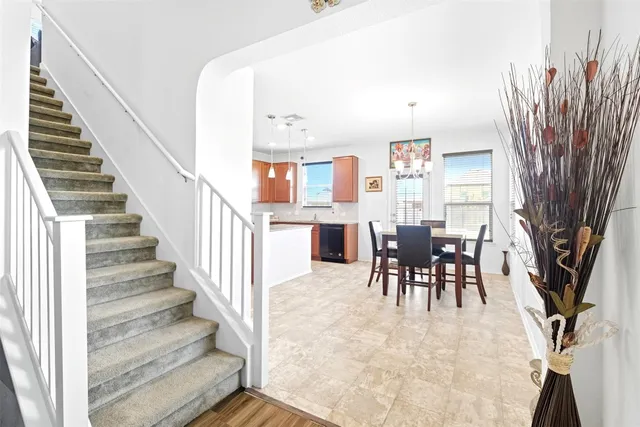a view of a livingroom with furniture and a dining room