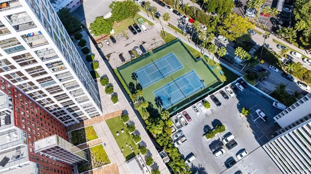 a view of balcony with wooden floor and outdoor seating