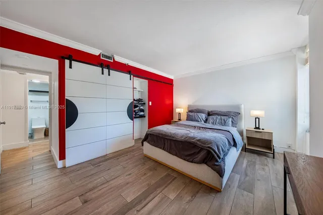 a bathroom with a shower and a glass door
