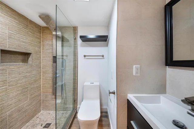 a view of a hallway with washer and dryer