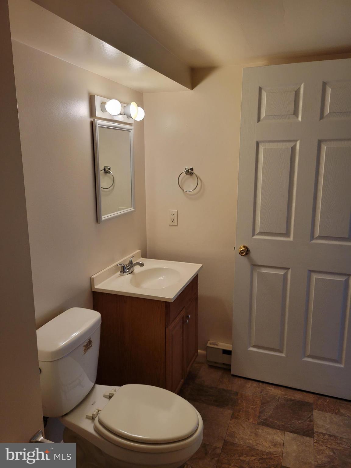 2095 Hosensack Road, Unit B Palm, PA 18070 - Photo 11 of 13 a bathroom with a sink a toilet and mirror
