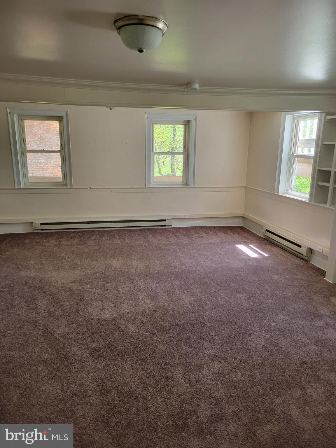 2095 Hosensack Road, Unit B Palm, PA 18070 - Photo 4 of 13 an empty room with windows