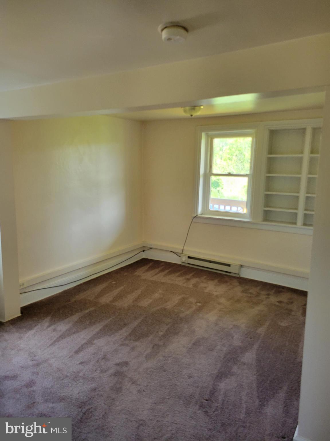 2095 Hosensack Road, Unit B Palm, PA 18070 - Photo 8 of 13 an empty room with a empty space and a window
