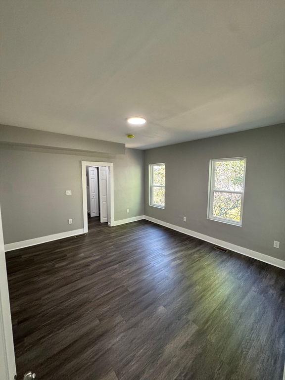 32 Main Street Monson, MA 01057 - Photo 23 of 42 an empty room with wooden floor and windows