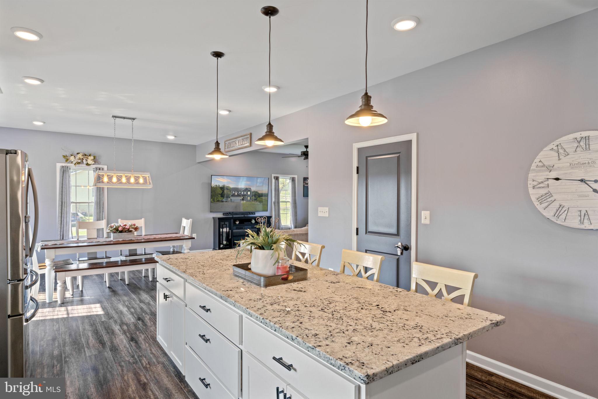 13401 Sillamon Road Goldvein, VA 22720 - Photo 13 of 52 Upgraded pendant lighting illuminates the island