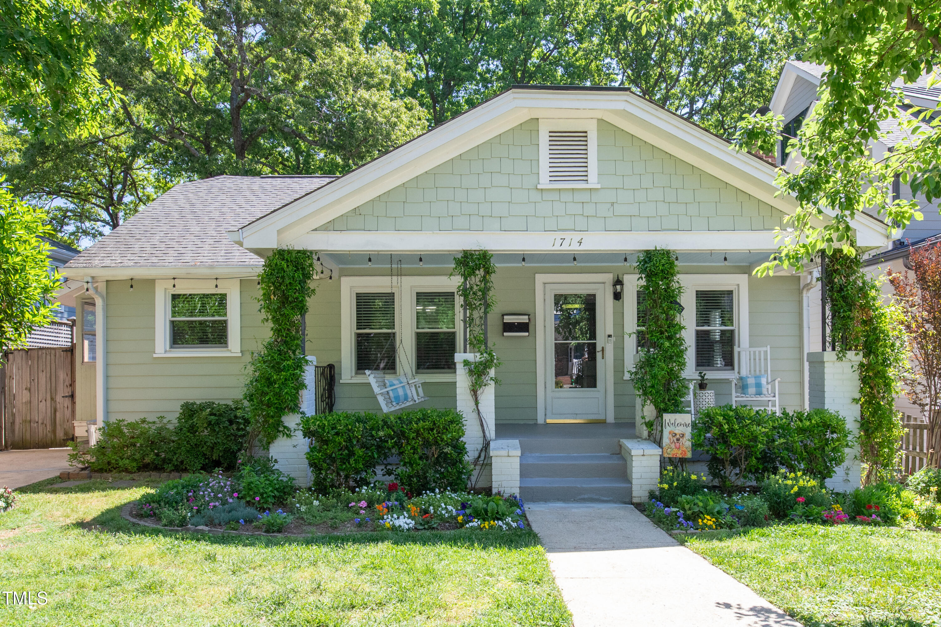 1714 Carson Street Raleigh, NC 27608 - Photo 1 of 38 a front view of a house with garden