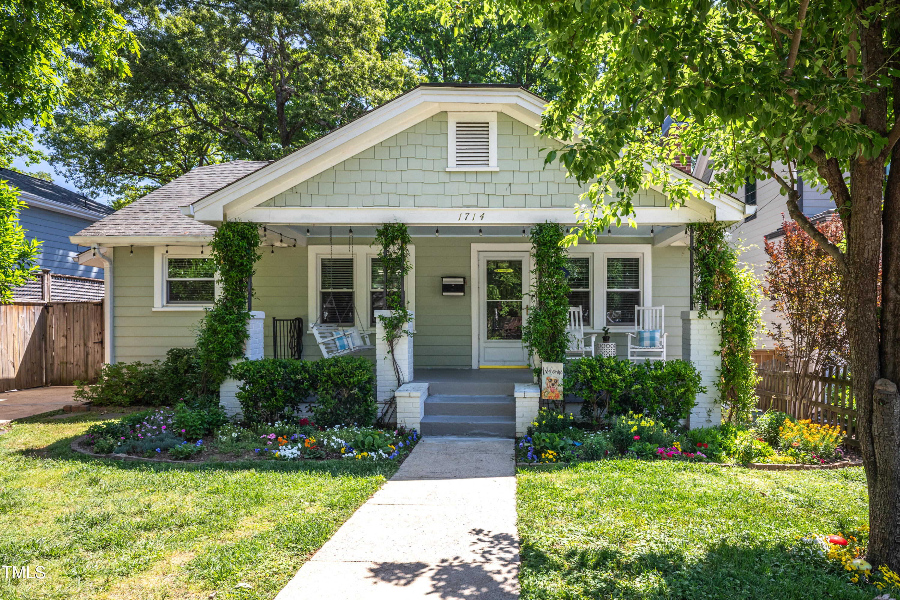 1714 Carson Street Raleigh, NC 27608 - Photo 2 of 38 a front view of a house with yard and green space