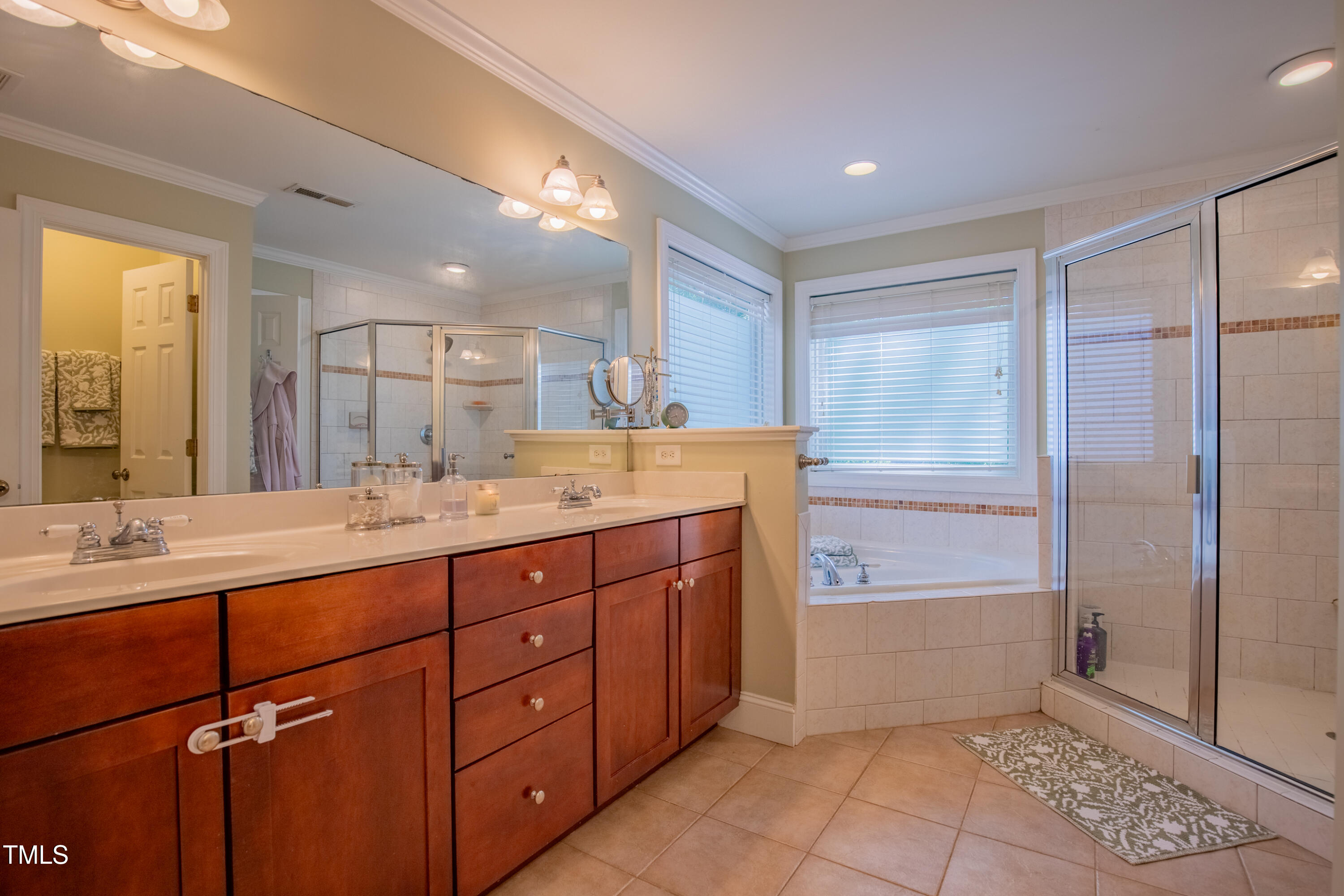 1714 Carson Street Raleigh, NC 27608 - Photo 24 of 38 a bath room with a sink double vanity and a mirror