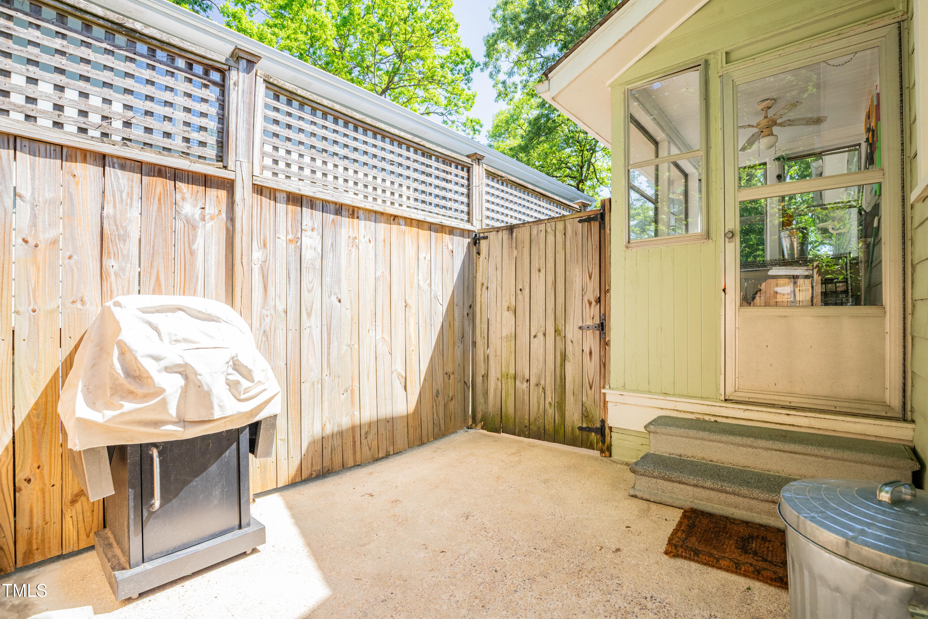 1714 Carson Street Raleigh, NC 27608 - Photo 32 of 38 a balcony with table and chairs