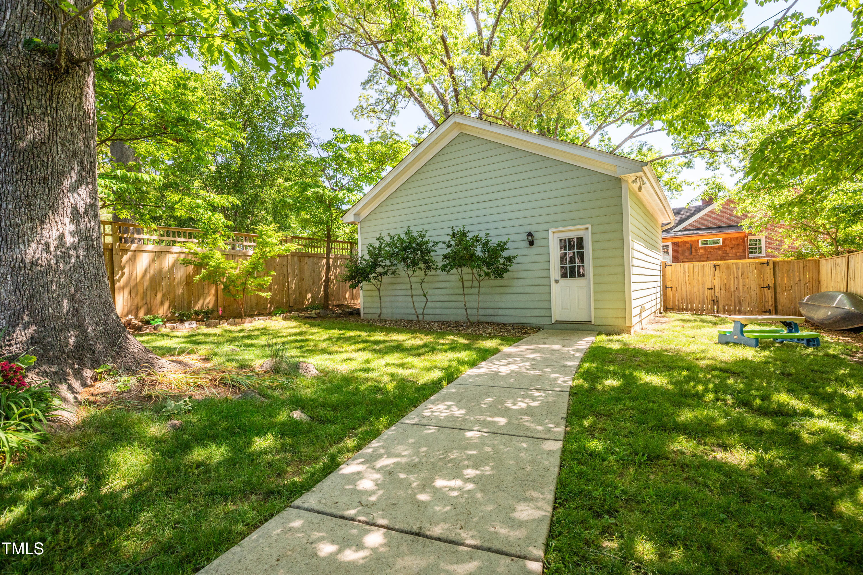 1714 Carson Street Raleigh, NC 27608 - Photo 37 of 38 a view of a house with yard and a garden
