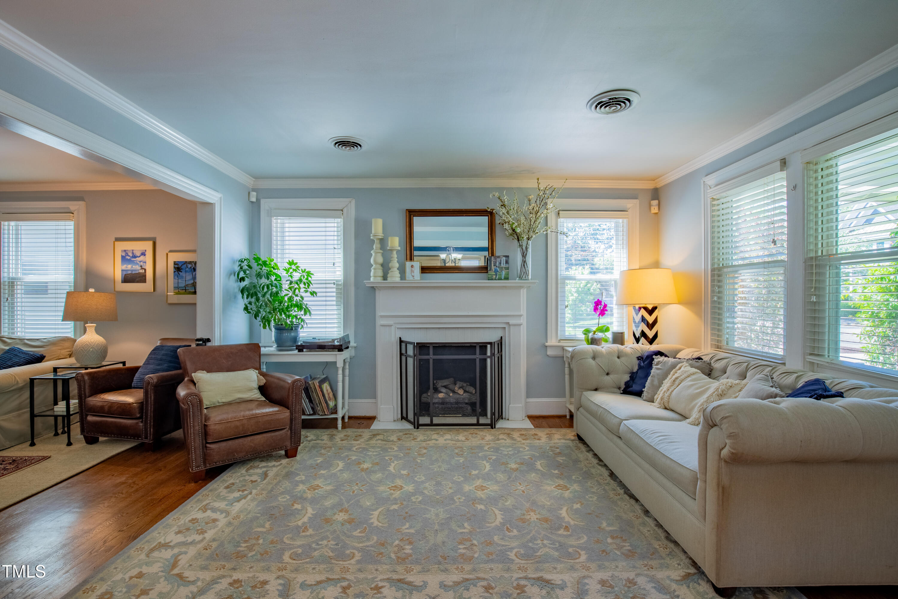 1714 Carson Street Raleigh, NC 27608 - Photo 7 of 38 a living room with furniture and a fireplace