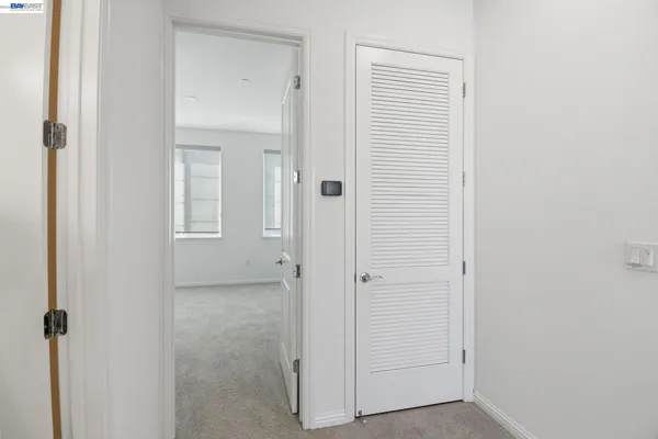 a view of a bathroom with white walls