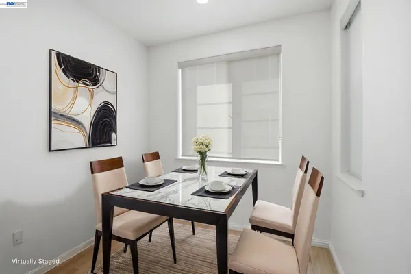 a view of a dining room with furniture and a window