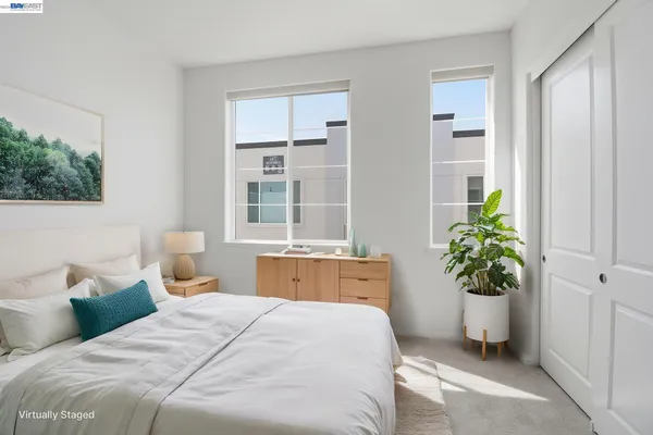 a bedroom with a bed and furniture