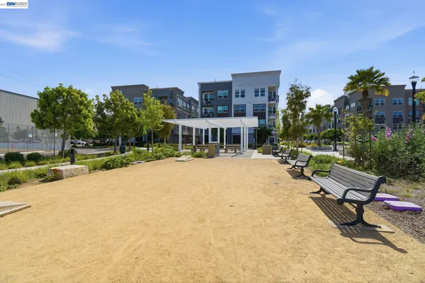 a swimming pool with outdoor seating and yard