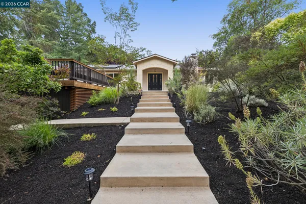 a front view of a house with garden