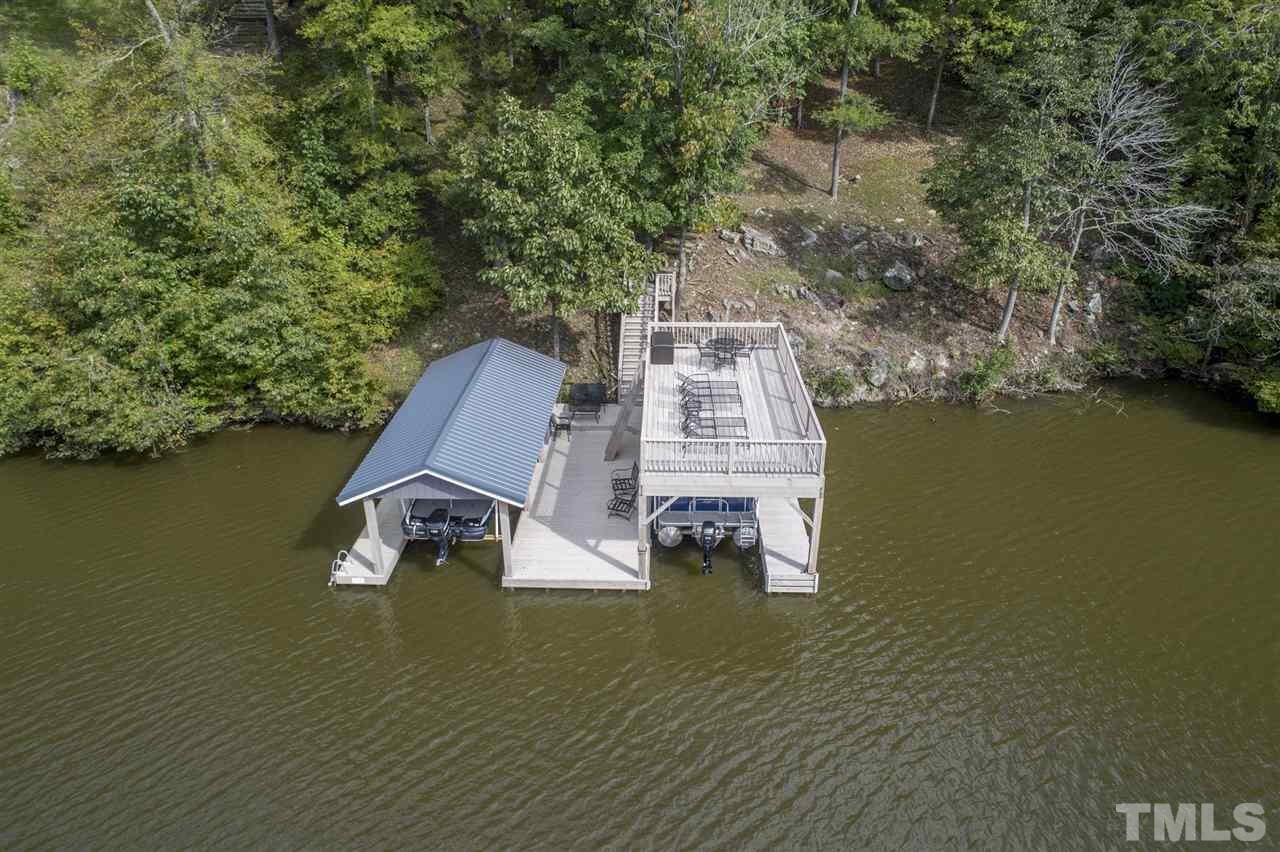 167 Hidden Hills Road Roxboro, NC 27574 - Photo 1 of 25 swimming pool view with a lake view