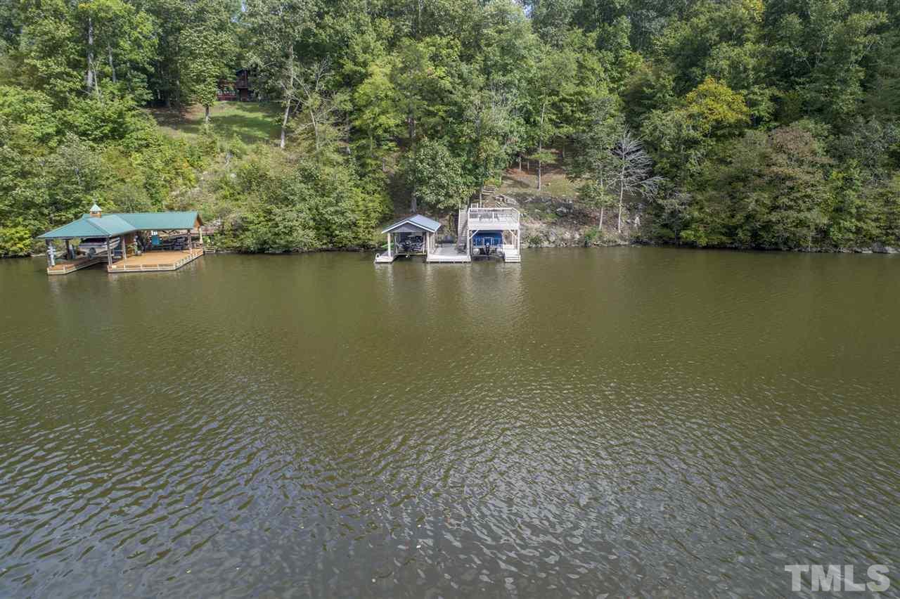 167 Hidden Hills Road Roxboro, NC 27574 - Photo 2 of 25 an aerial view of ocean with residential house with outdoor space and trees around