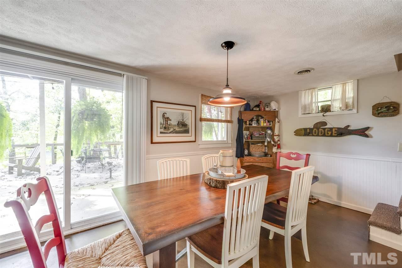 167 Hidden Hills Road Roxboro, NC 27574 - Photo 20 of 25 a view of a dining room with furniture window and outside view