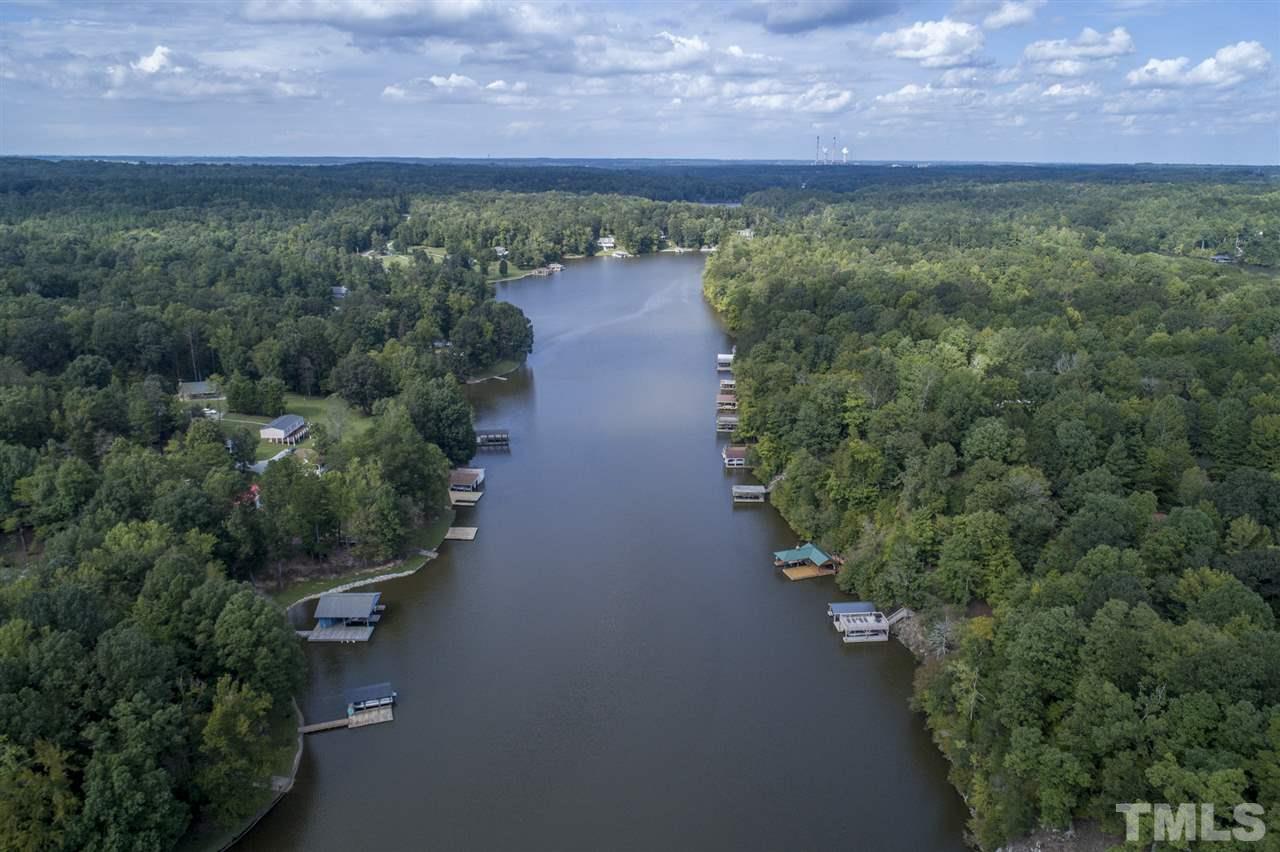 167 Hidden Hills Road Roxboro, NC 27574 - Photo 3 of 25 an aerial view of a houses with a yard and lake view
