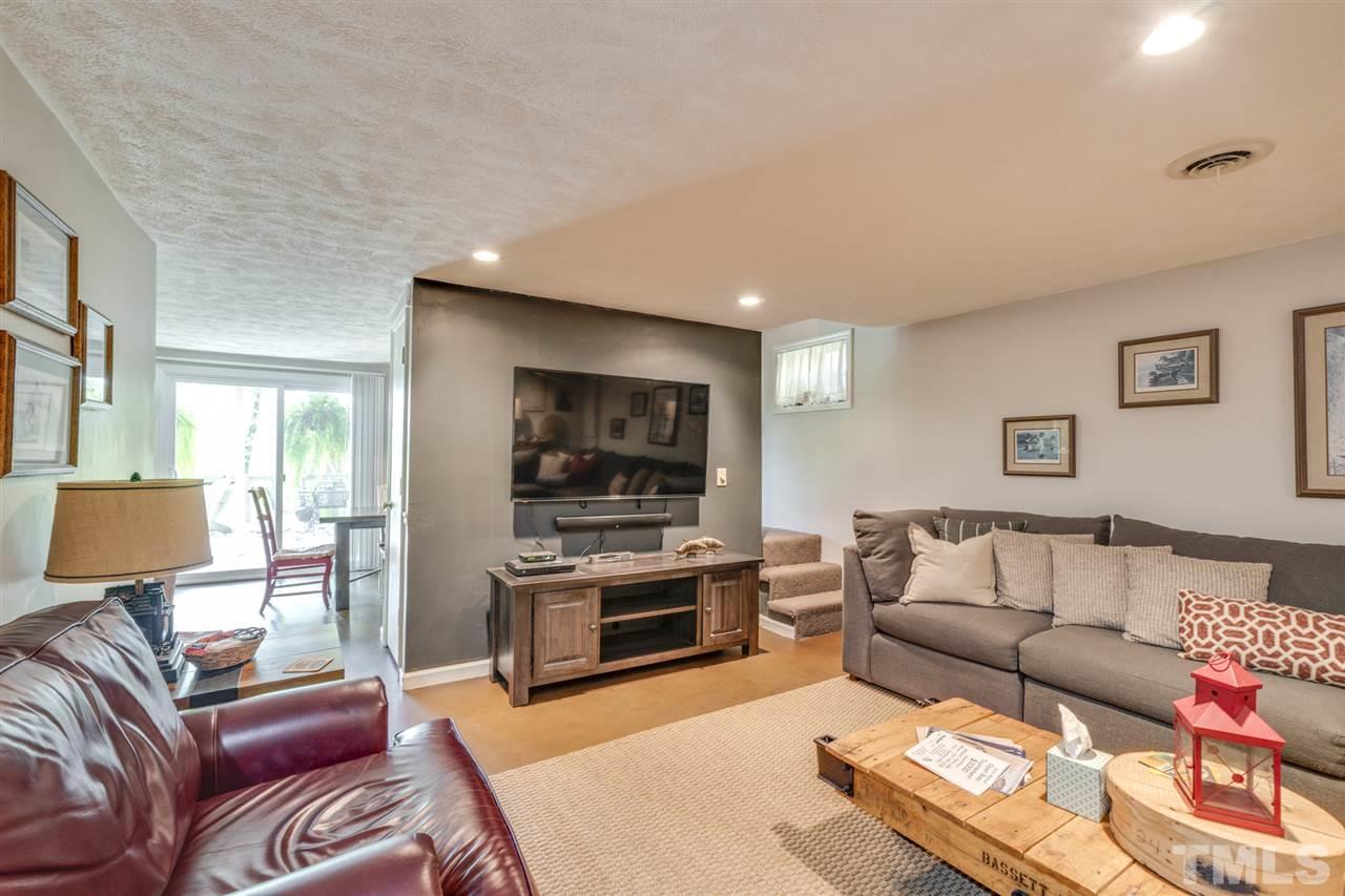 167 Hidden Hills Road Roxboro, NC 27574 - Photo 22 of 25 a living room with furniture and a flat screen tv