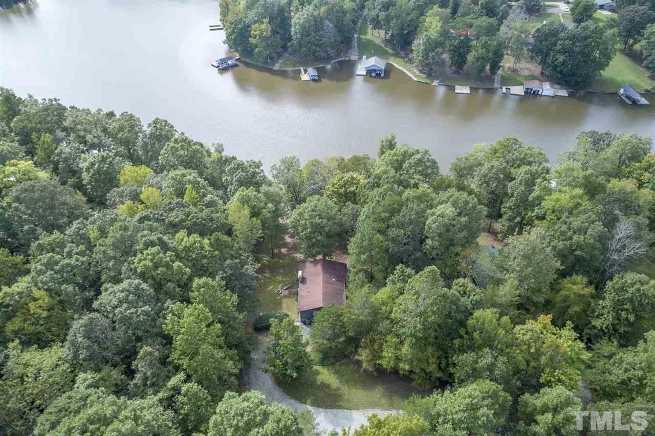 167 Hidden Hills Road Roxboro, NC 27574 - Photo 4 of 25 an aerial view of residential house with outdoor space and lake view