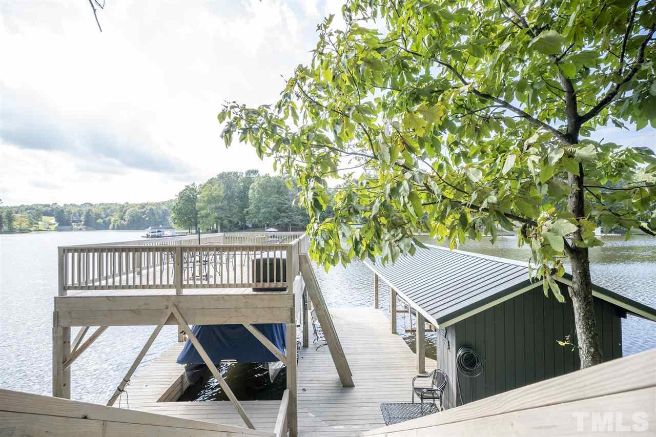 167 Hidden Hills Road Roxboro, NC 27574 - Photo 7 of 25 view of balcony with wooden floor and outdoor seating